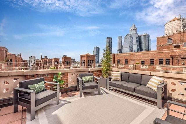 view of patio / terrace with an outdoor living space and a city view