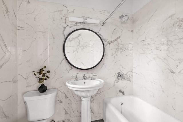 bathroom with shower / bathing tub combination and toilet