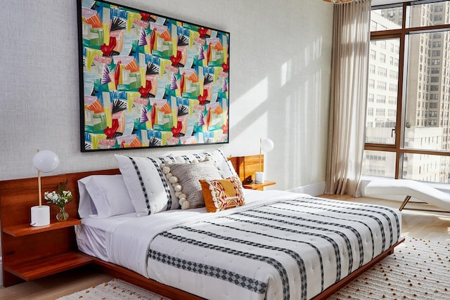 bedroom with wood finished floors