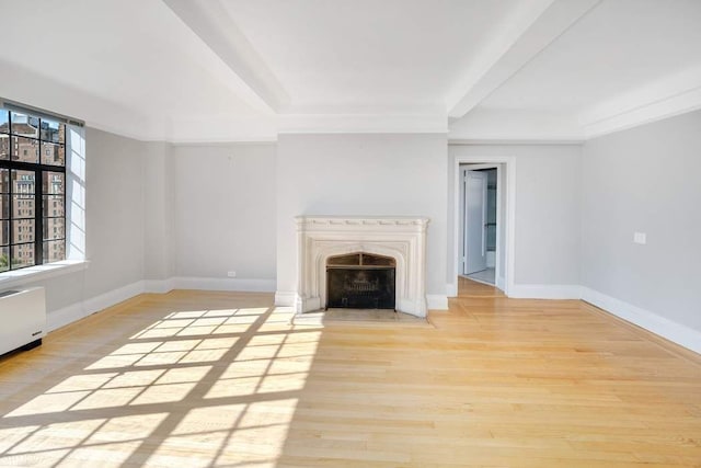 unfurnished living room with light wood-type flooring