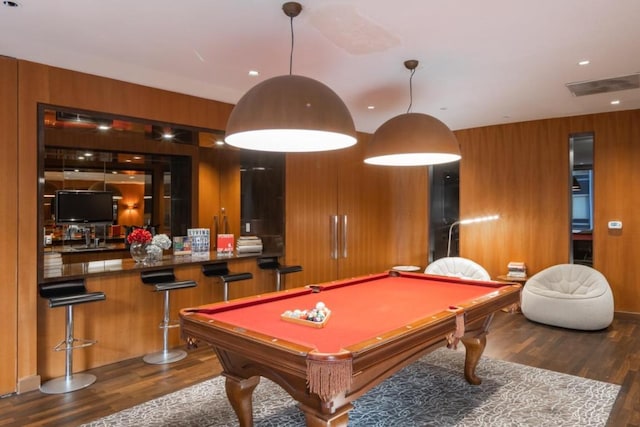 playroom featuring pool table, dark wood-type flooring, and wood walls