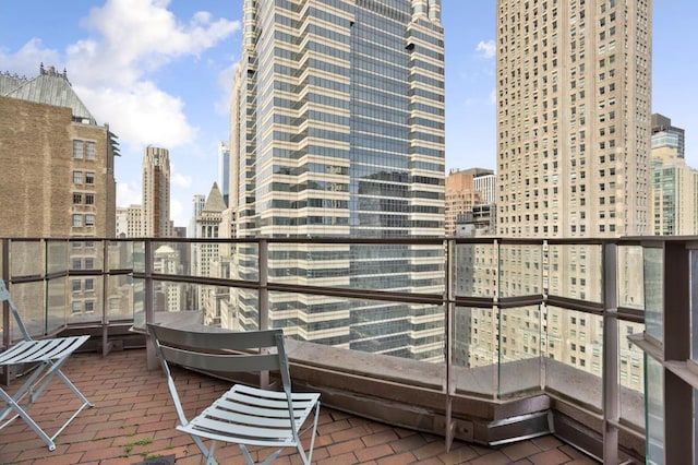 balcony featuring a view of city and a patio