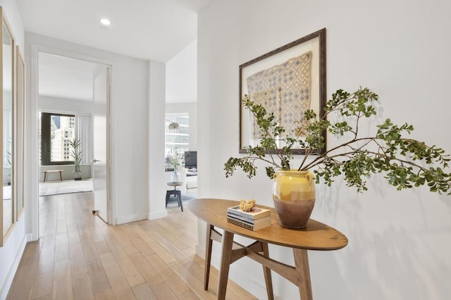 hall with light hardwood / wood-style floors