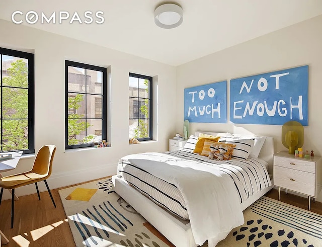 537 Pacific St, New York City, NY 11217 - bedroom featuring baseboards and wood finished floors