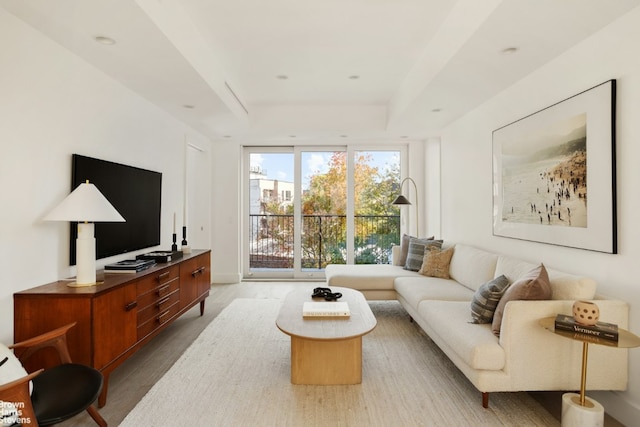 living room with expansive windows and light wood-type flooring