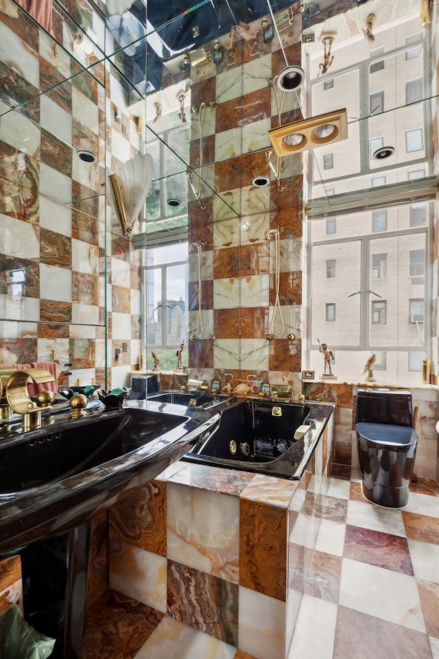 kitchen featuring tasteful backsplash and tile walls