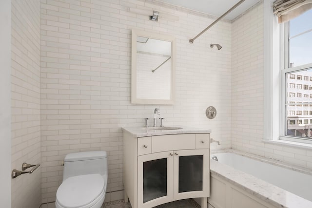 40 E 66th St Unit 4B, New York City, NY 10065 - bathroom with tile walls, toilet, vanity, and shower / bath combination