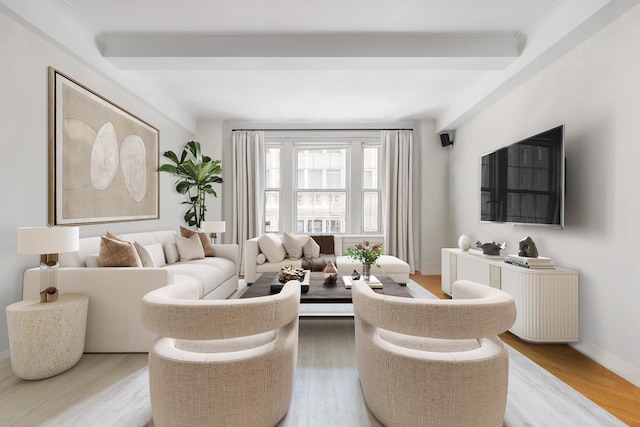 40 E 66th St Unit 4B, New York City, NY 10065 - living room featuring beam ceiling, light wood-type flooring, baseboards, and ornamental molding
