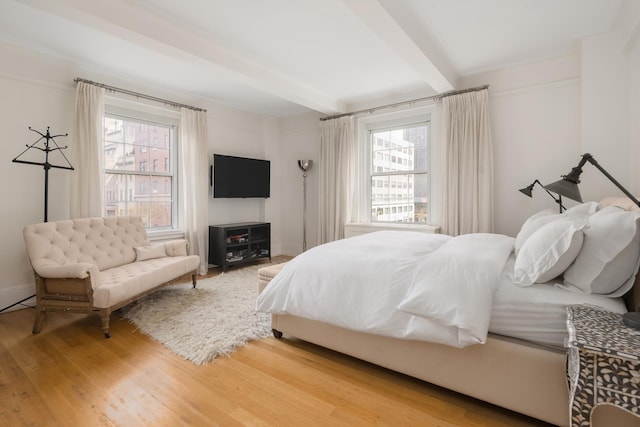 40 E 66th St Unit 4B, New York City, NY 10065 - bedroom with beamed ceiling and wood finished floors