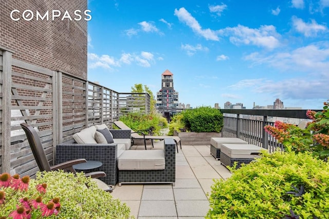 view of patio featuring an outdoor living space and a view of city