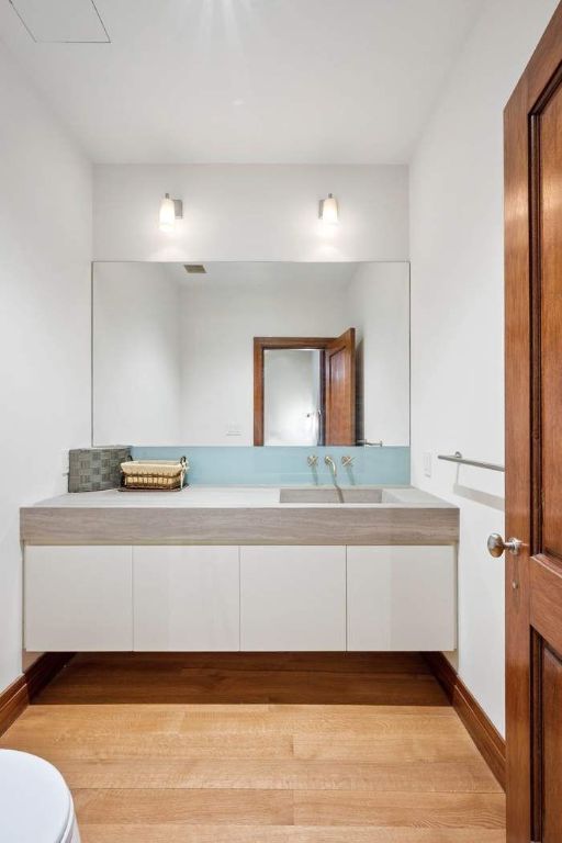 full bathroom with tile walls, vanity, shower / bath combo, and toilet