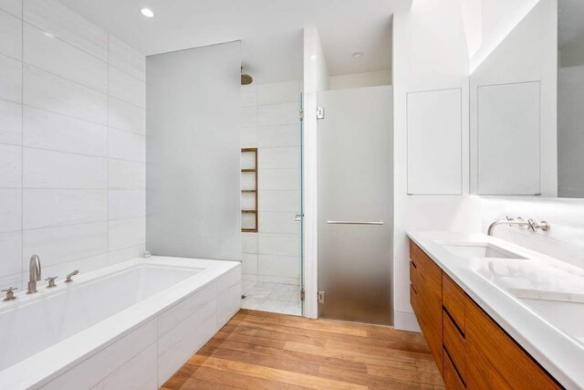 bedroom with ornamental molding and light wood-type flooring