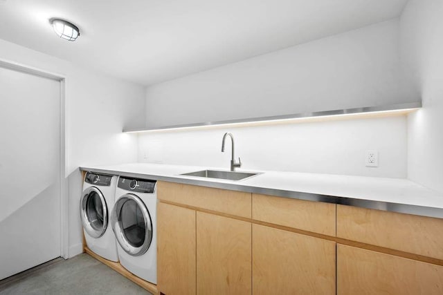 kitchen featuring sink, decorative light fixtures, light brown cabinets, a kitchen island with sink, and wall chimney range hood