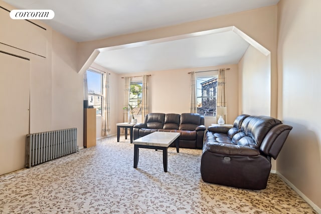 carpeted living room featuring radiator