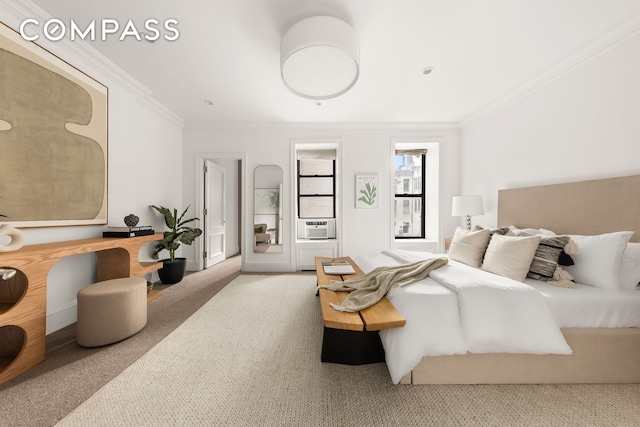 bedroom featuring cooling unit, ornamental molding, and carpet floors