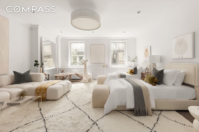 bedroom with crown molding, a decorative wall, and wainscoting