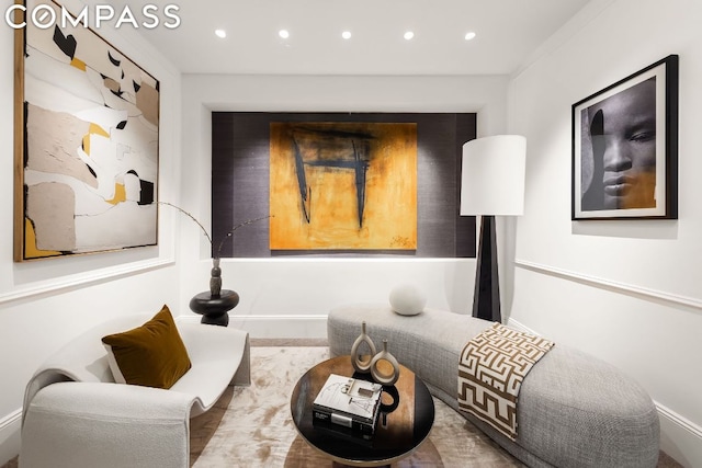 sitting room featuring ornamental molding