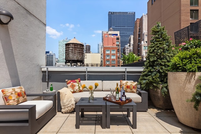 balcony with a view of city and outdoor lounge area