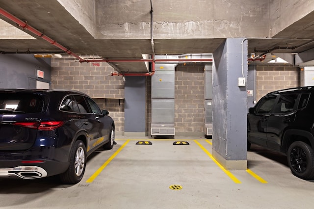 parking garage featuring concrete block wall