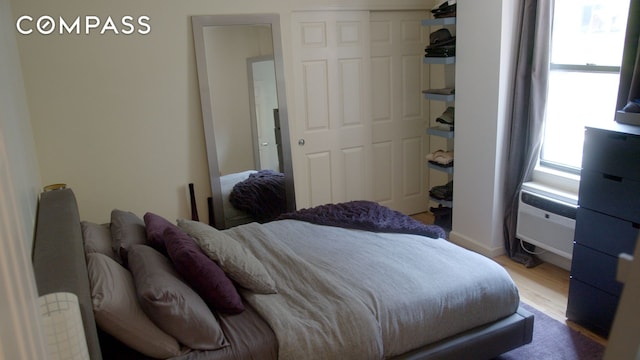 bedroom with a closet and wood finished floors