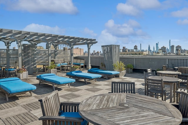 390 Riverside Dr Unit 5G, New York City, NY 10025 - view of patio / terrace with a pergola, a view of skyline, and outdoor lounge area