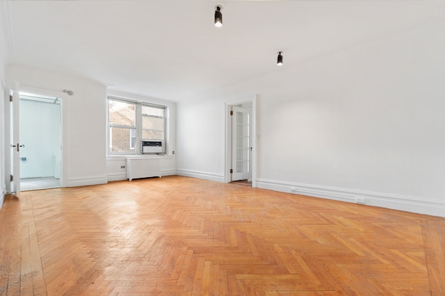 390 Riverside Dr Unit 5G, New York City, NY 10025 - spare room featuring baseboards and cooling unit