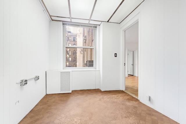 390 Riverside Dr Unit 5G, New York City, NY 10025 - unfurnished room featuring wood walls and radiator