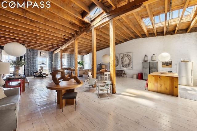 basement with refrigerator and hardwood / wood-style floors