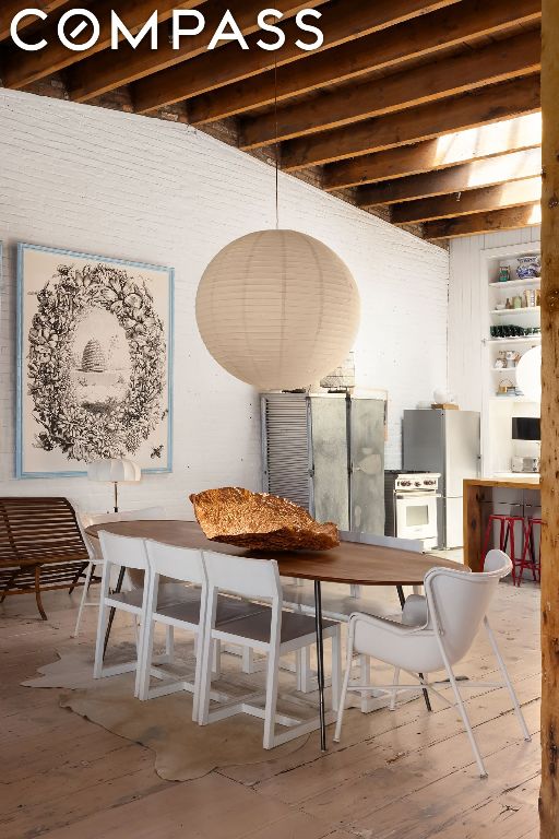 dining space featuring beam ceiling and built in features