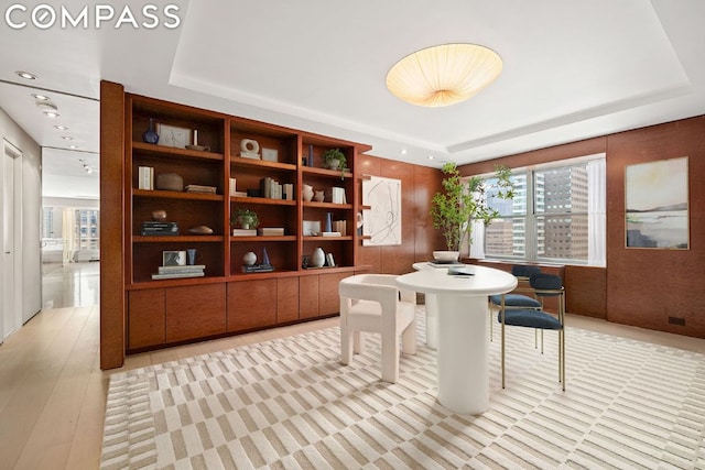 dining room with a tray ceiling