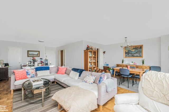 living area featuring a notable chandelier