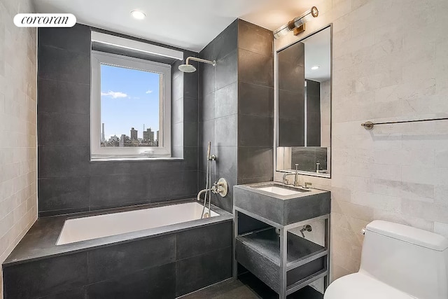 full bathroom with tiled shower / bath combo, vanity, tile walls, and toilet