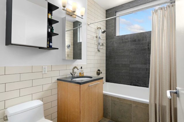 full bathroom featuring vanity, tile walls, shower / tub combo, and toilet