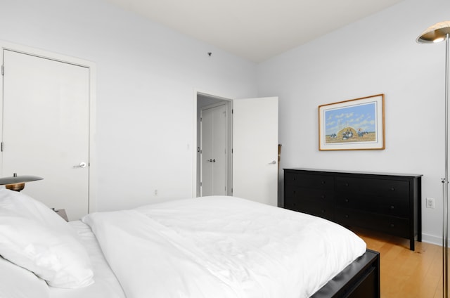 bedroom with light wood-type flooring