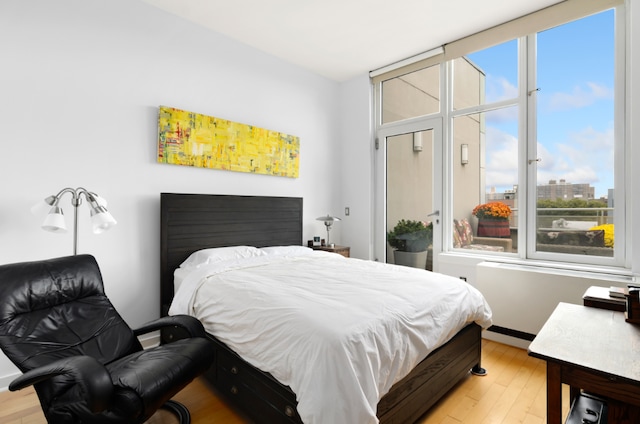 bedroom with light hardwood / wood-style floors