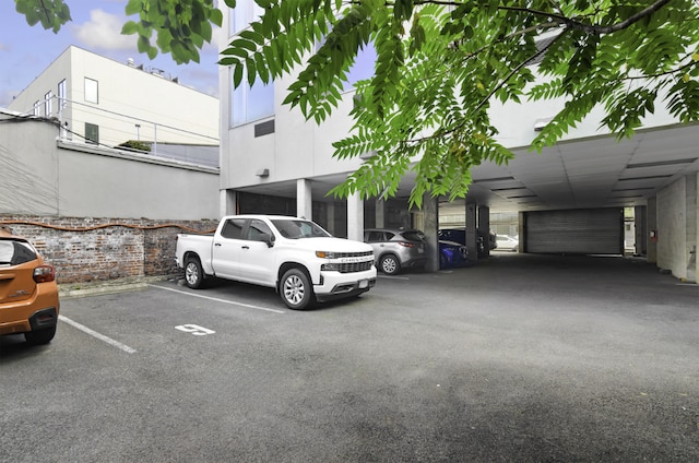 view of vehicle parking featuring a carport