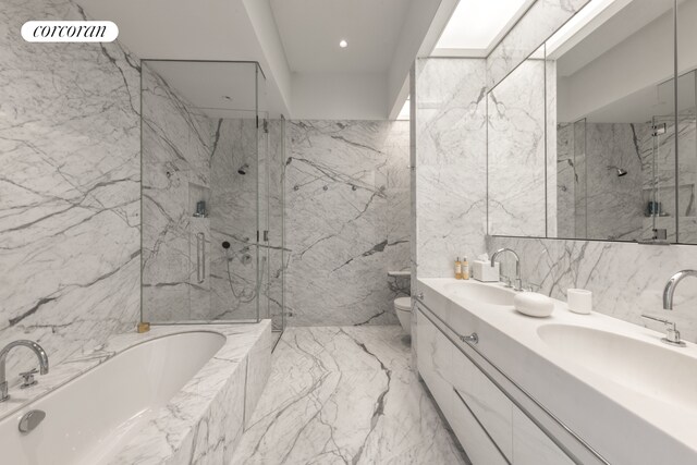 full bathroom featuring toilet, vanity, shower with separate bathtub, and tile walls