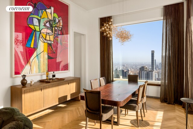 dining area featuring light parquet floors