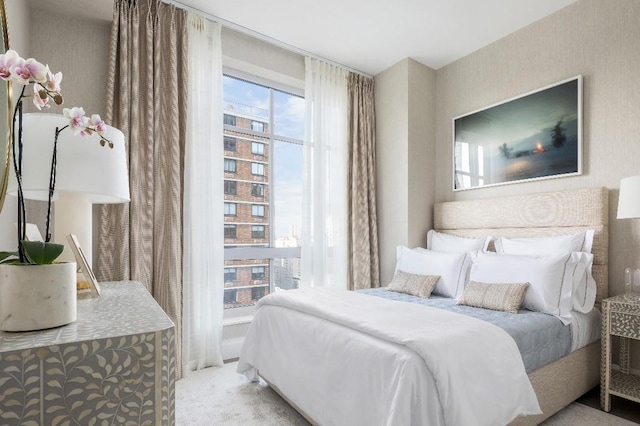 bedroom with light colored carpet