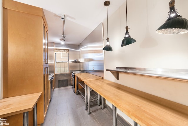 kitchen featuring hanging light fixtures and rail lighting