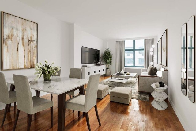 dining area with wood-type flooring