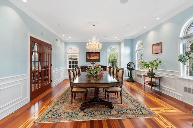 dining room with recessed lighting, wood finished floors, visible vents, and an inviting chandelier