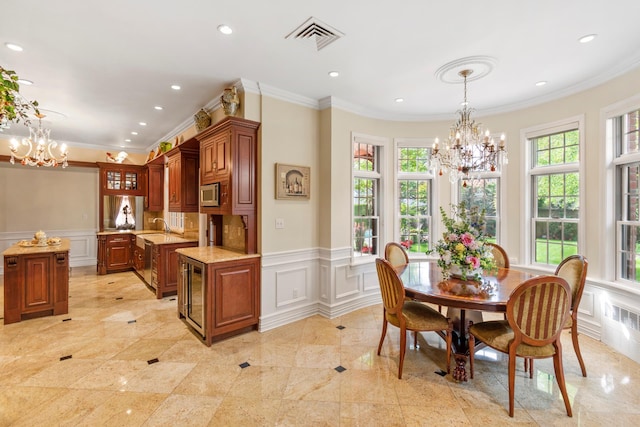 dining room with plenty of natural light, visible vents, and a notable chandelier