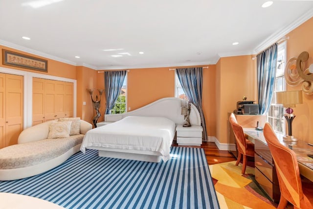 bedroom featuring light hardwood / wood-style flooring and ornamental molding