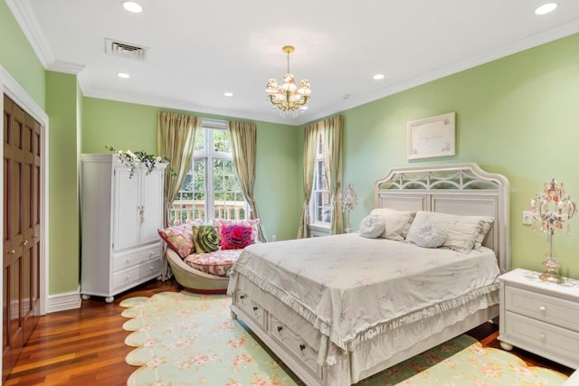 bedroom featuring dark wood-type flooring, crown molding, and an inviting chandelier