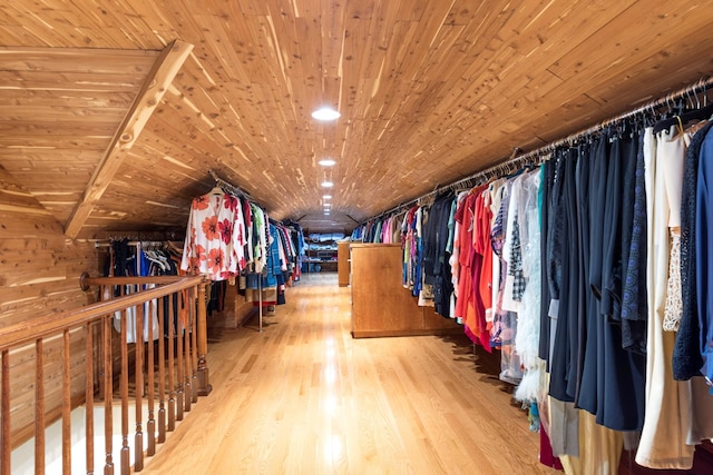 walk in closet with wood finished floors