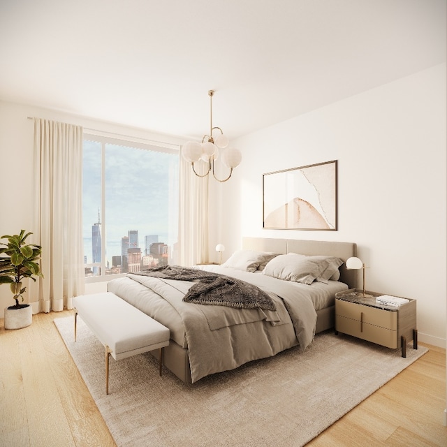 bedroom with hardwood / wood-style floors and a chandelier