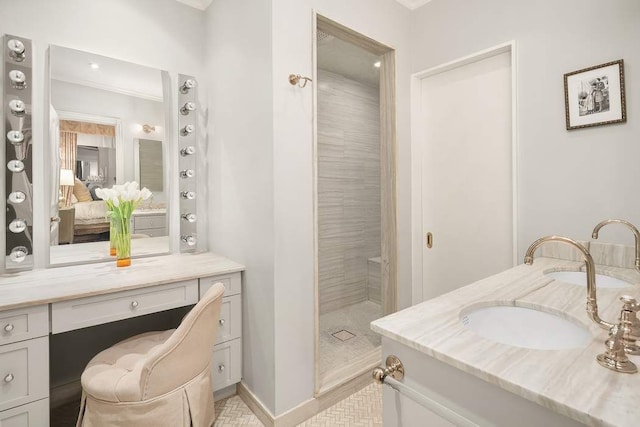 bathroom featuring vanity and tiled shower