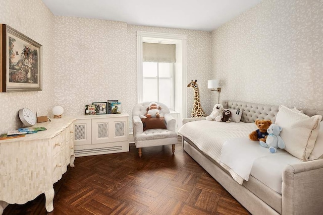 bedroom with dark parquet flooring