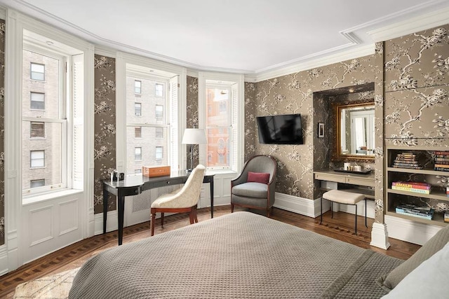 living area with ornamental molding, a wealth of natural light, and dark hardwood / wood-style flooring